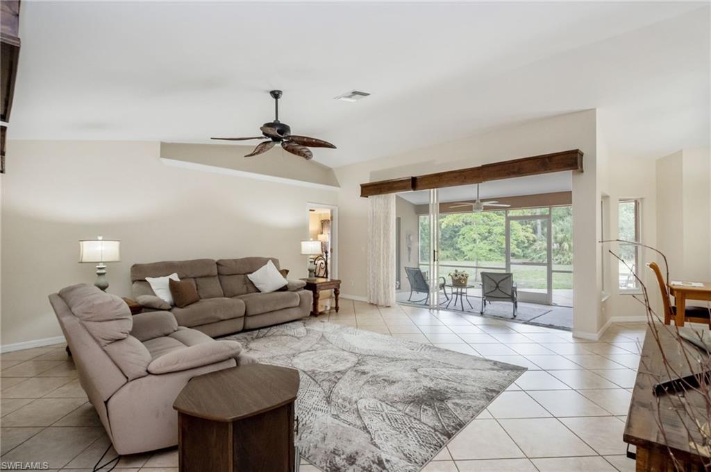 2910 2nd Street Northeast Naples, FL 34120 - Photo 7 of 36 a living room with furniture and a large window
