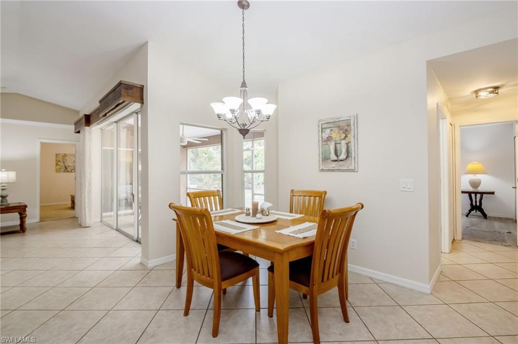2910 2nd Street Northeast Naples, FL 34120 - Photo 9 of 36 a dining room with furniture and window