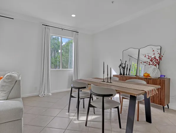 a view of a dining room with furniture and window