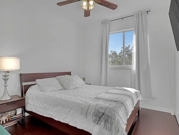 a bathroom with a granite countertop toilet a sink and a mirror