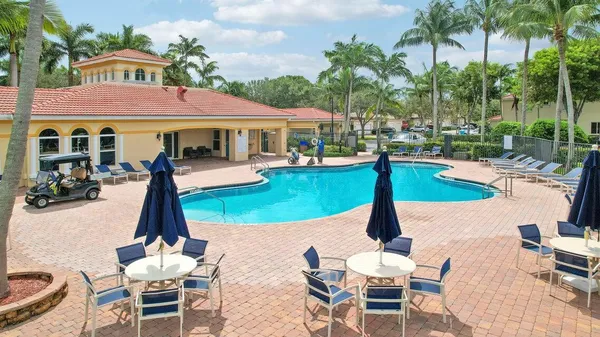a view of a backyard with sitting area