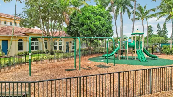 a view of a table and chairs under an umbrella