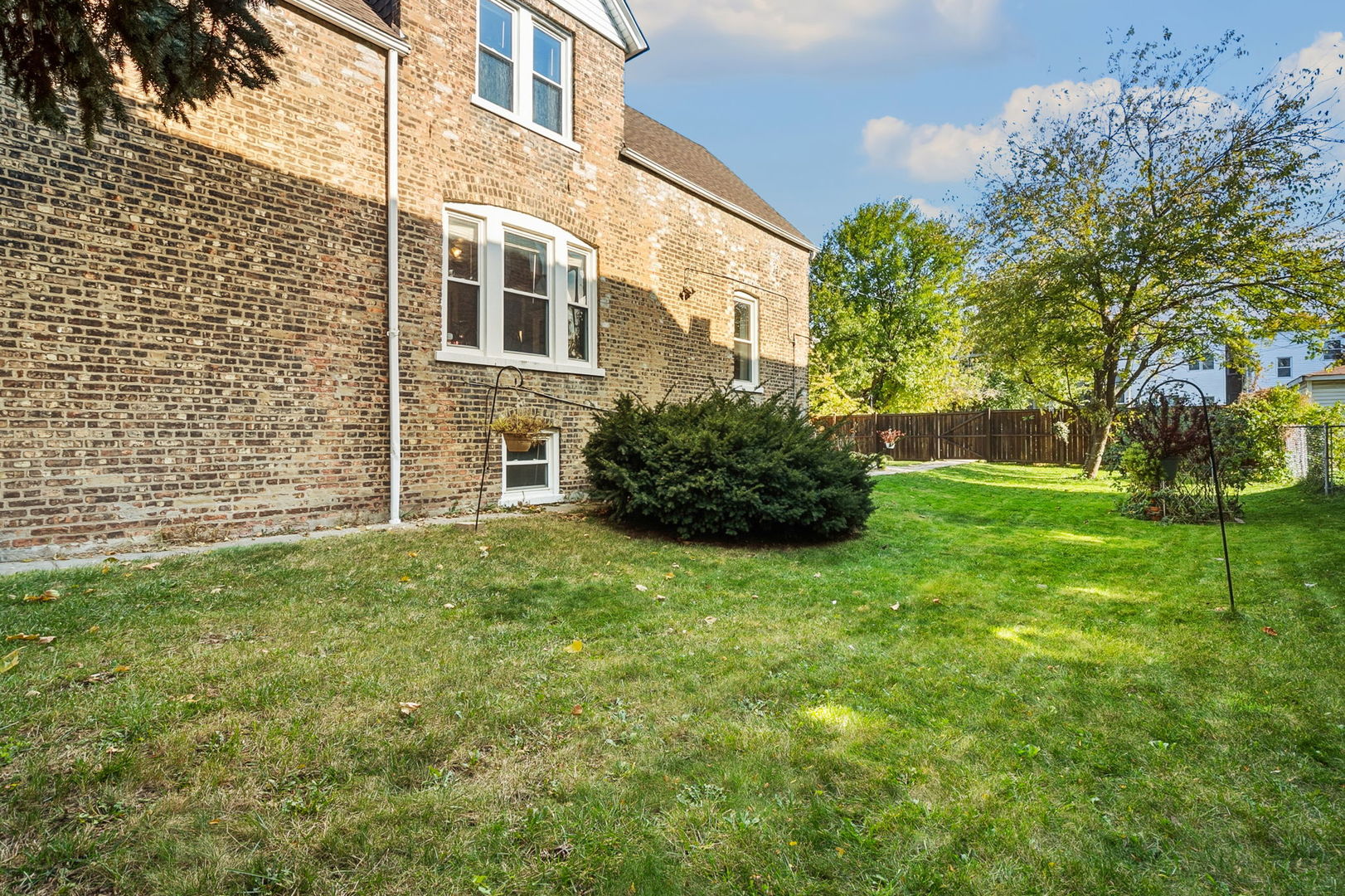 7127 South St Lawrence Avenue Chicago, IL 60619 - Photo 23 of 26 a view of a backyard with plants and large trees
