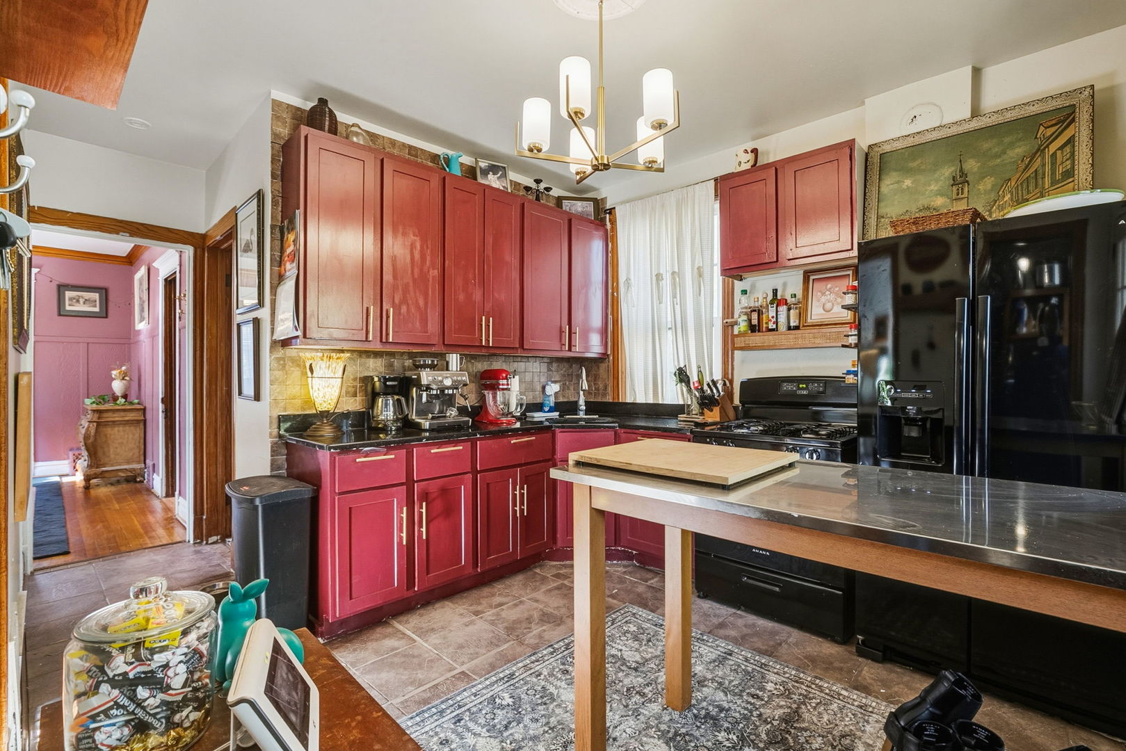 7127 South St Lawrence Avenue Chicago, IL 60619 - Photo 7 of 26 a kitchen with a sink stove and cabinets