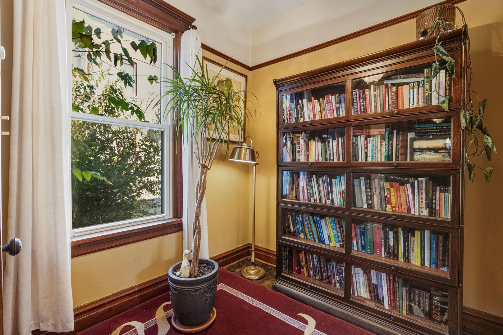 7127 South St Lawrence Avenue Chicago, IL 60619 - Photo 10 of 26 a view of a living room and a book shelf
