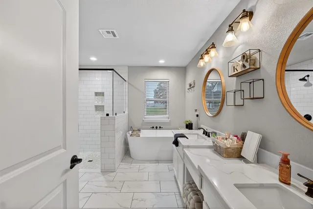 a bathroom with a bathtub and sink