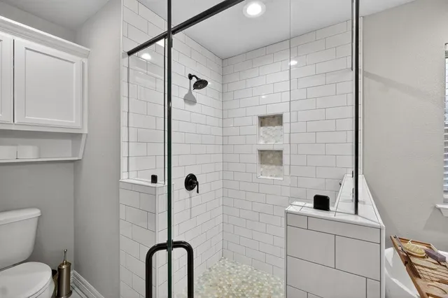 a kitchen with appliances cabinets and a table