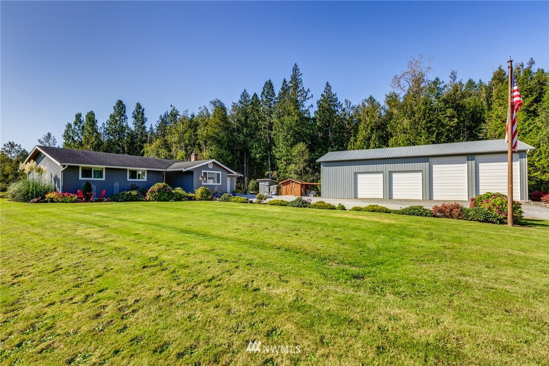 3141 Loomis Trail Road Custer, WA 98240 - Photo 1 of 25 a front view of house with yard and trees in the background
