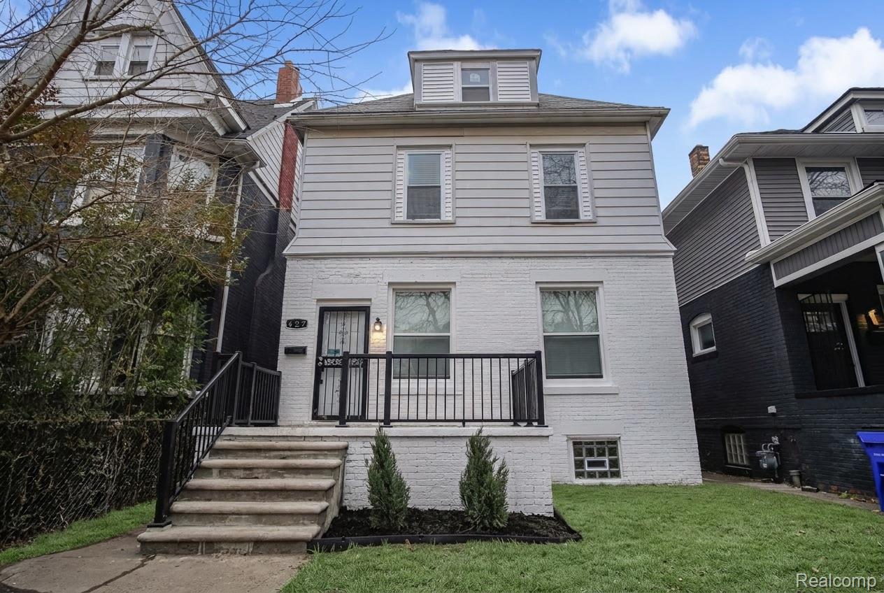 427 Melbourne Street Detroit, MI 48202 - Photo 1 of 29 Three-story residence featuring a white brick first level and light-colored siding on upper floors