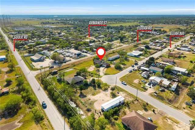 an aerial view of residential building and ocean