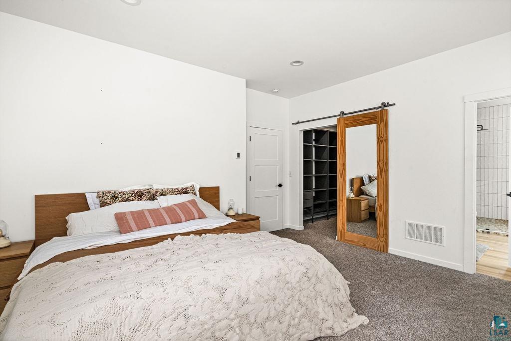 1825 East Shilhon Road Duluth, MN 55804 - Photo 23 of 37 Large master primary bedroom.