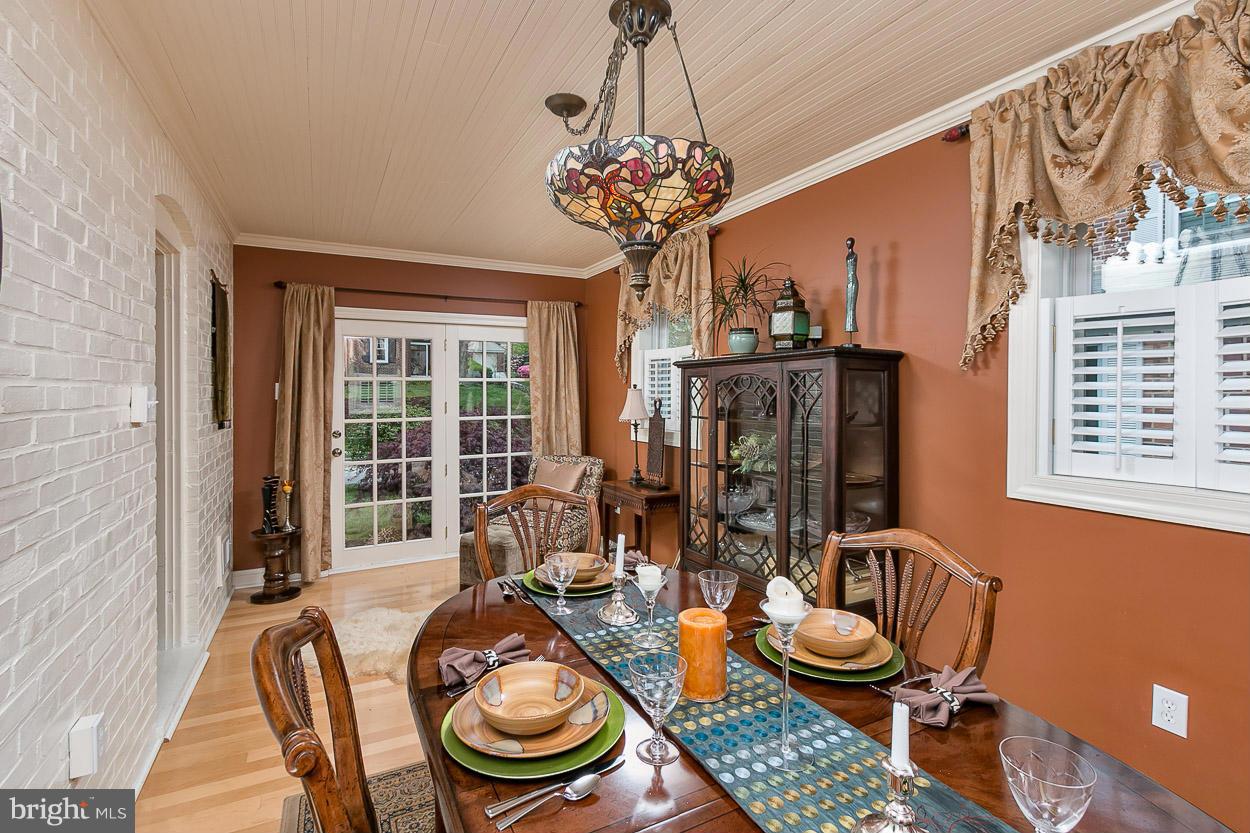 505 Sussex Road Towson, MD 21286 - Photo 11 of 30 a view of a dining room with furniture wooden floor and chandelier