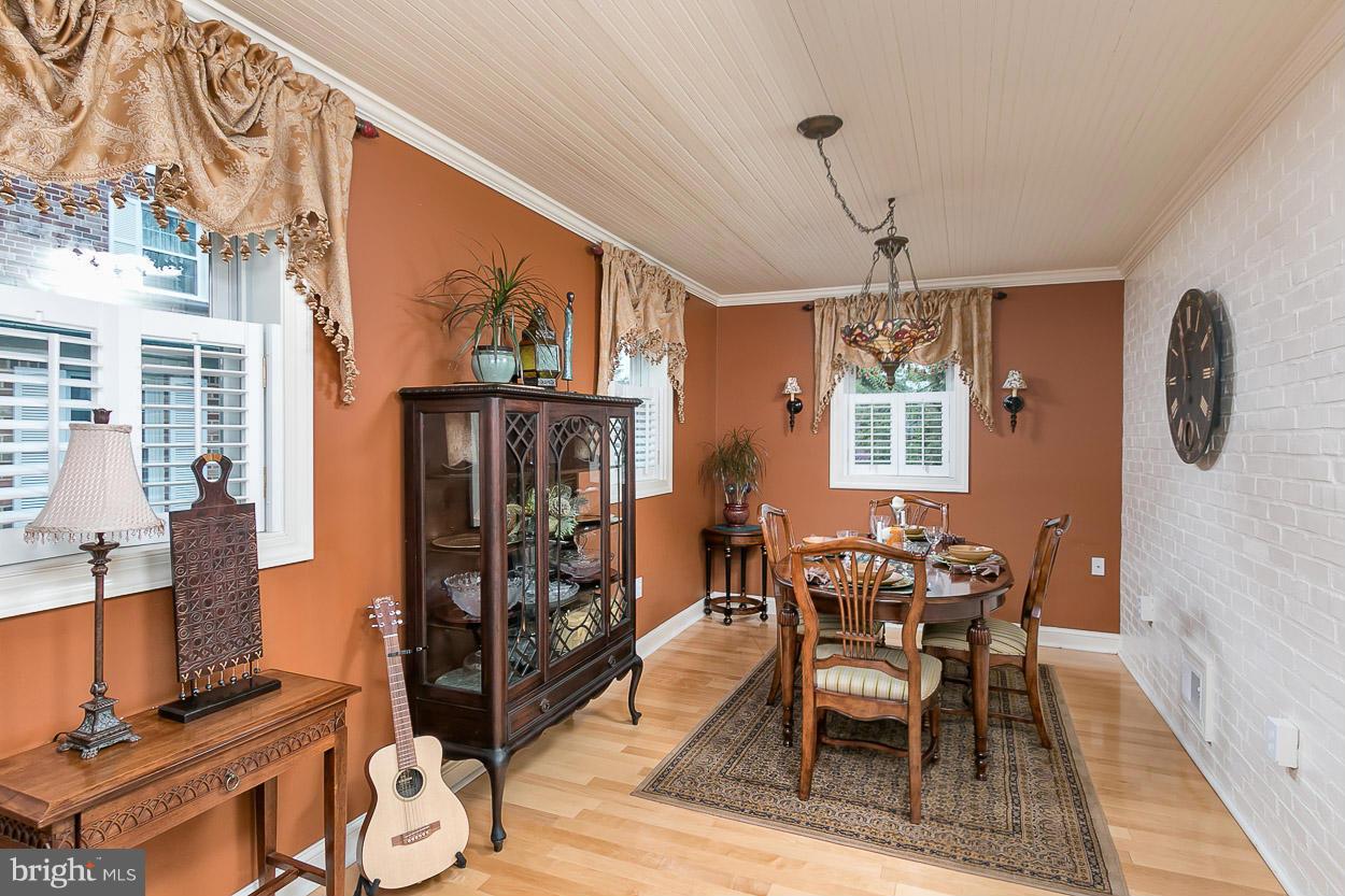 505 Sussex Road Towson, MD 21286 - Photo 12 of 30 a view of a dining room with furniture window and wooden floor