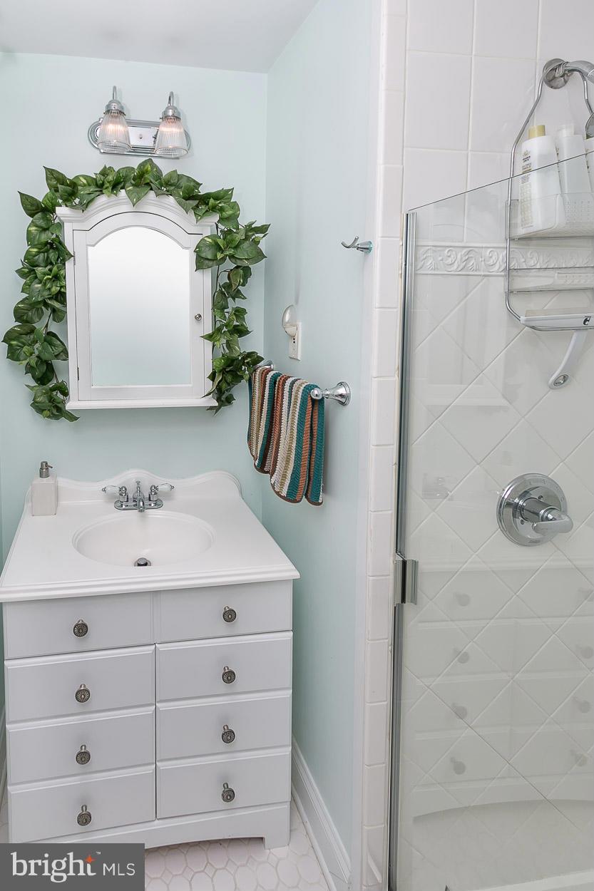 505 Sussex Road Towson, MD 21286 - Photo 23 of 30 a bathroom with a sink vanity and mirror