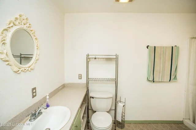 a view of a balcony with wooden floor and outdoor space