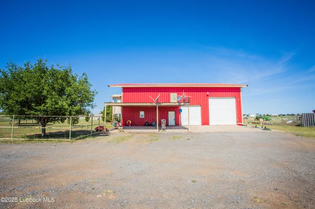 a spacious bedroom with a bed and a window