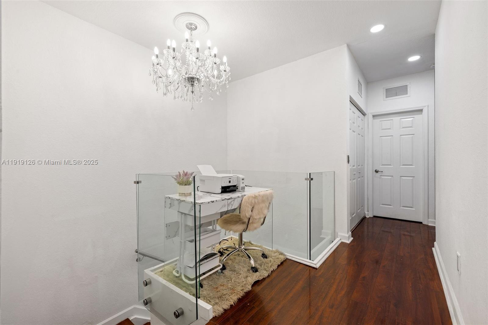 8780 Northwest 116th Path Doral, FL 33178 - Photo 19 of 32 a view of a workspace with furniture and chandelier