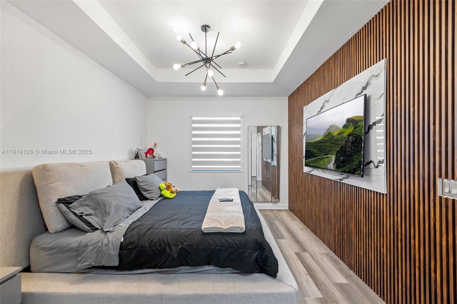 8780 Northwest 116th Path Doral, FL 33178 - Photo 22 of 32 a living room with furniture and a flat screen tv