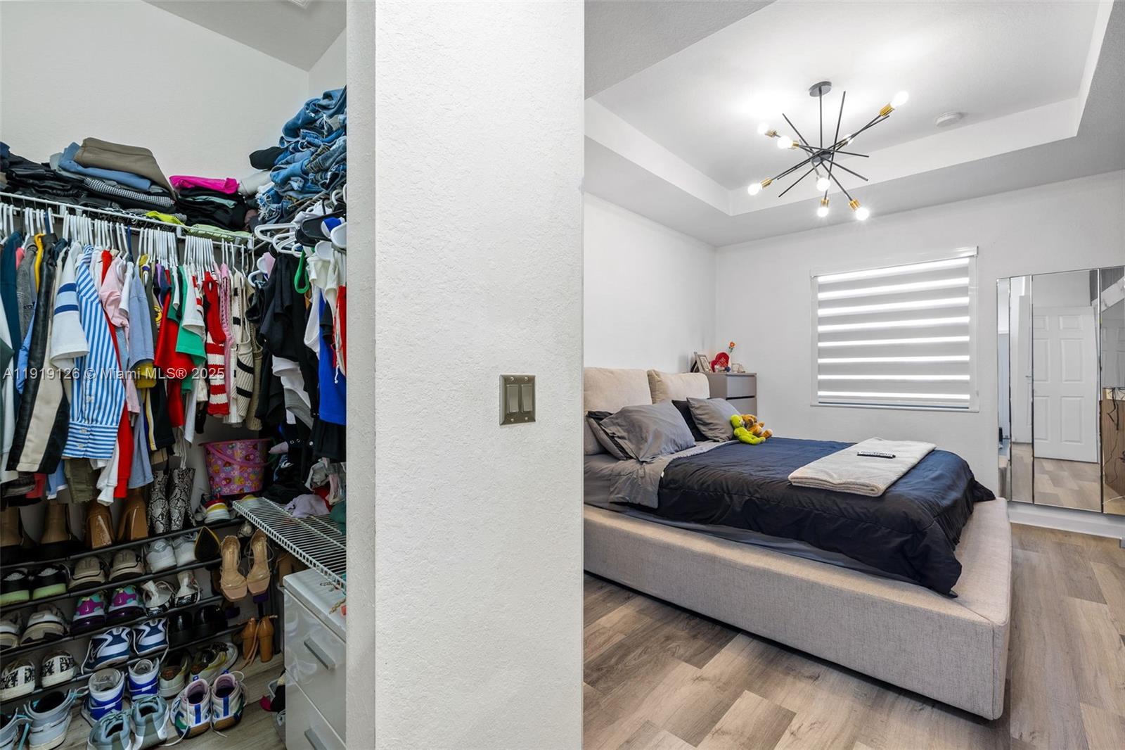 8780 Northwest 116th Path Doral, FL 33178 - Photo 23 of 32 a living room with lots of clothes and shoes