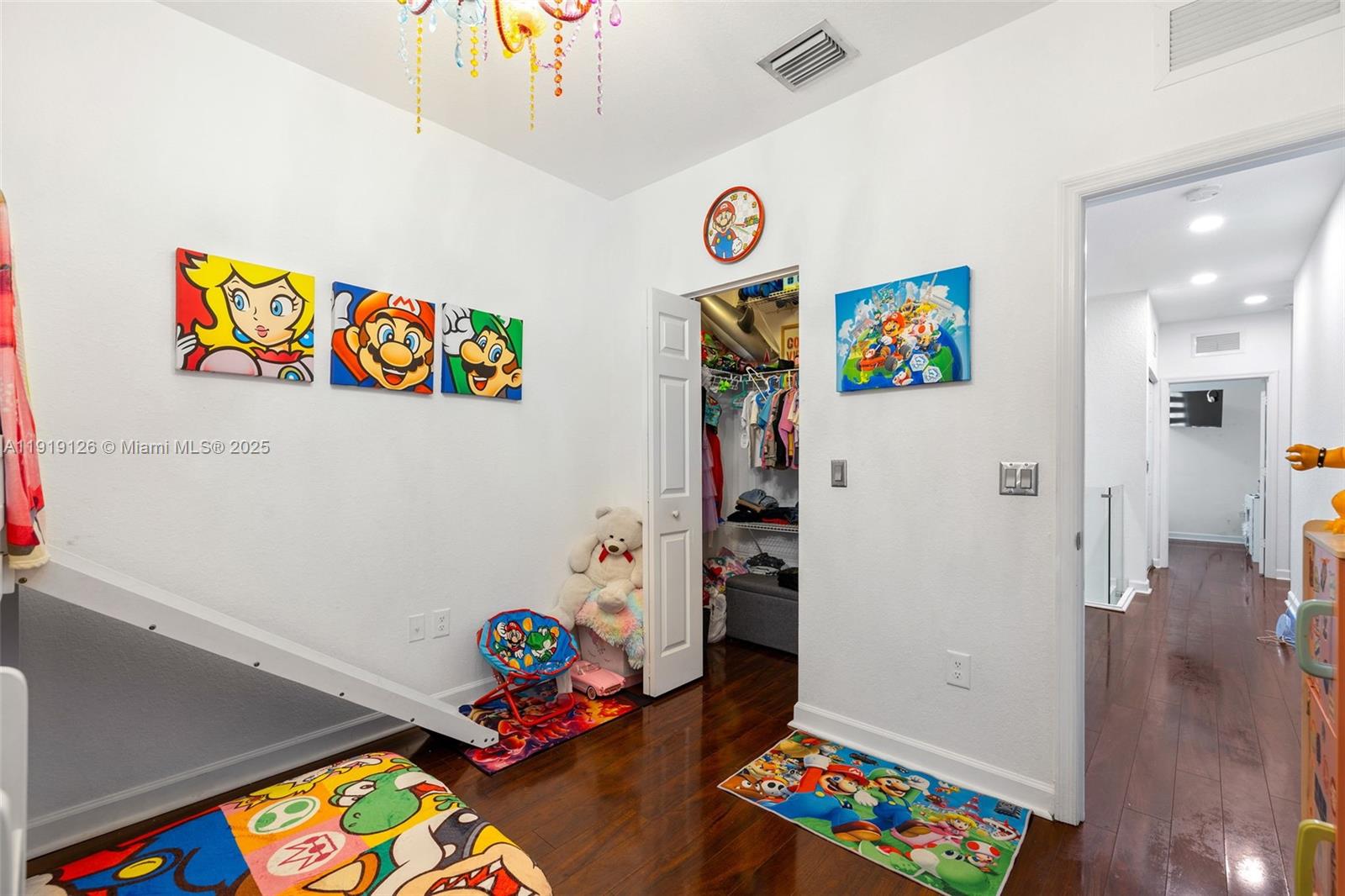 8780 Northwest 116th Path Doral, FL 33178 - Photo 29 of 32 an empty room with toys and wooden floor