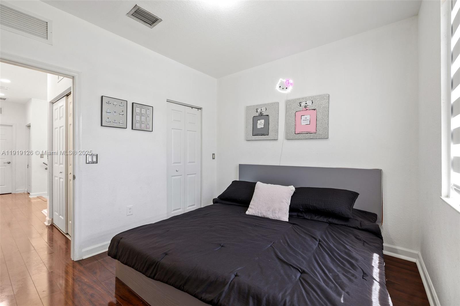 8780 Northwest 116th Path Doral, FL 33178 - Photo 31 of 32 a bedroom with a bed and a window