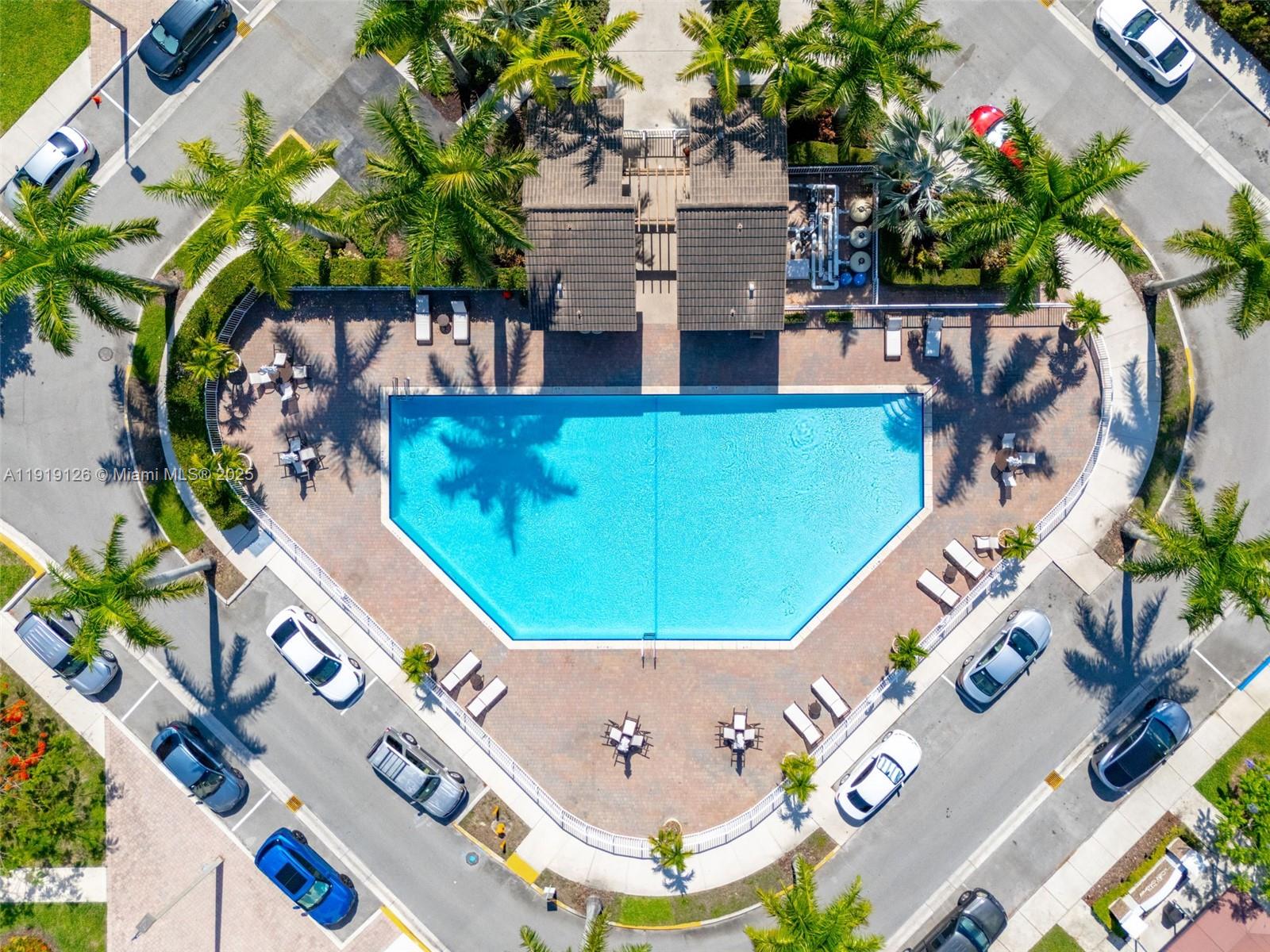 8780 Northwest 116th Path Doral, FL 33178 - Photo 6 of 32 a view of a swimming pool with a patio