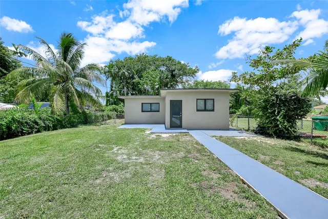 a house view with a garden space