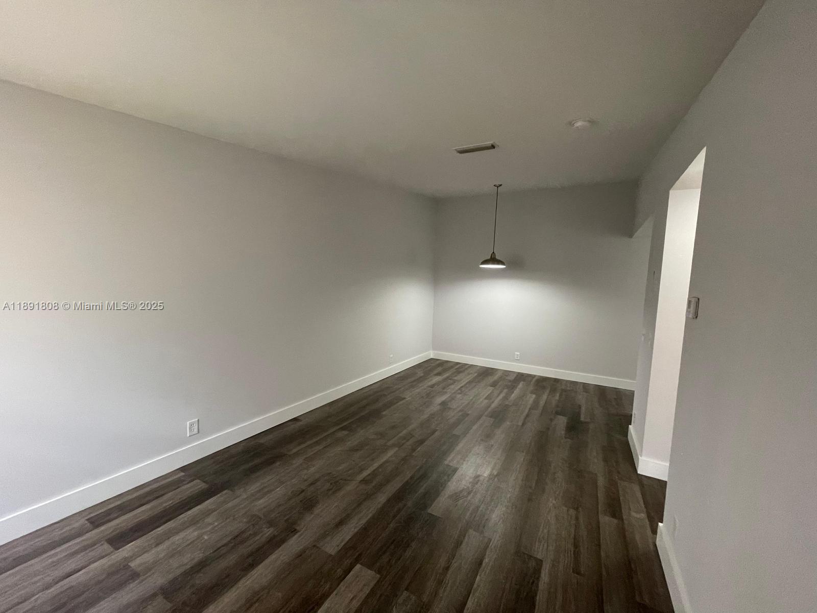 5040 Sanctuary Way, Unit B West Palm Beach, FL 33417 - Photo 6 of 10 wooden floor in an empty room