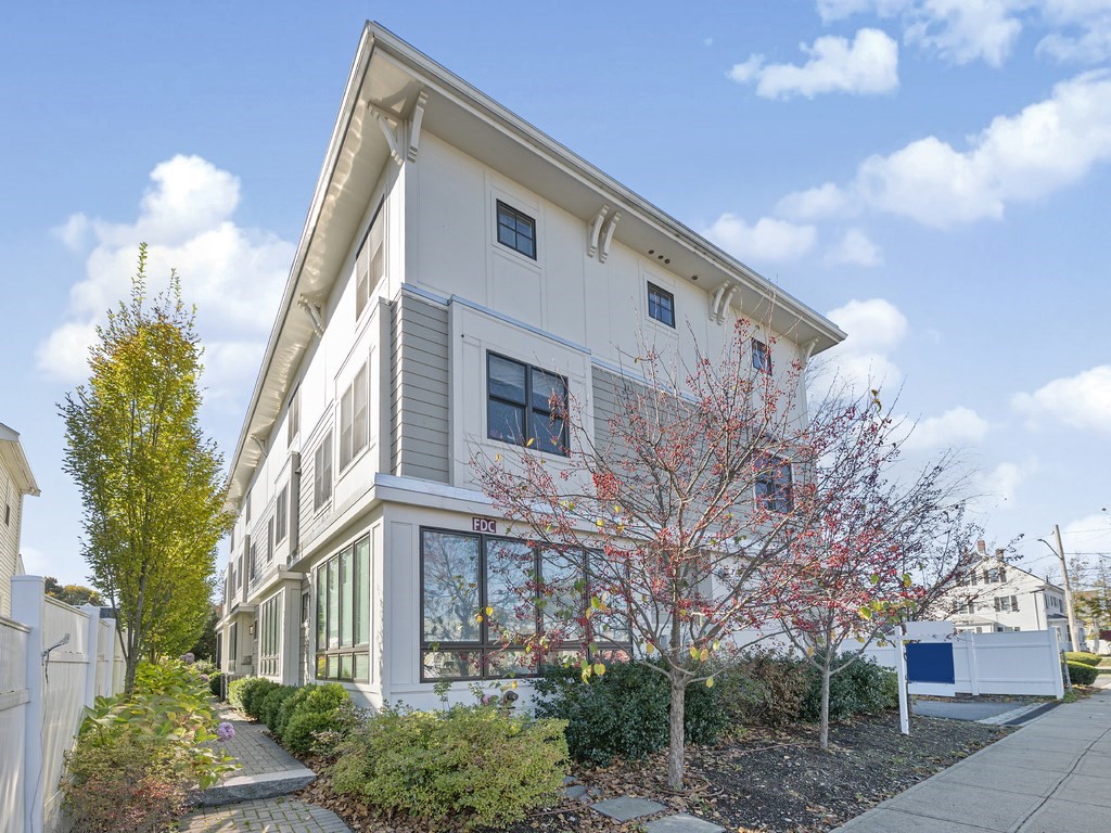 198 California Street, Unit 3 Newton, MA 02458 - Photo 1 of 34 a front view of a house with a yard