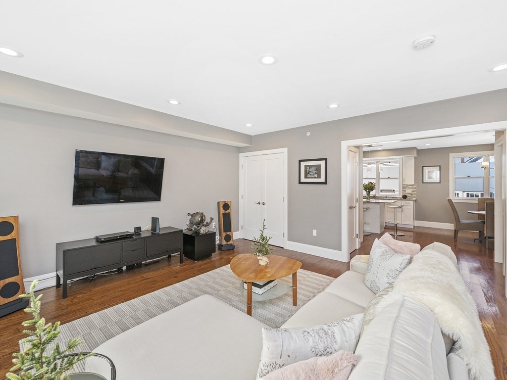 198 California Street, Unit 3 Newton, MA 02458 - Photo 14 of 34 a living room with furniture and a flat screen tv