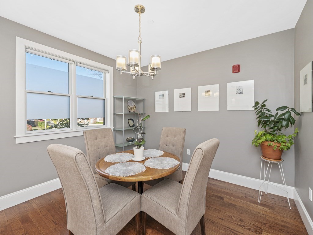198 California Street, Unit 3 Newton, MA 02458 - Photo 15 of 34 a view of a dining room with furniture and wooden floor