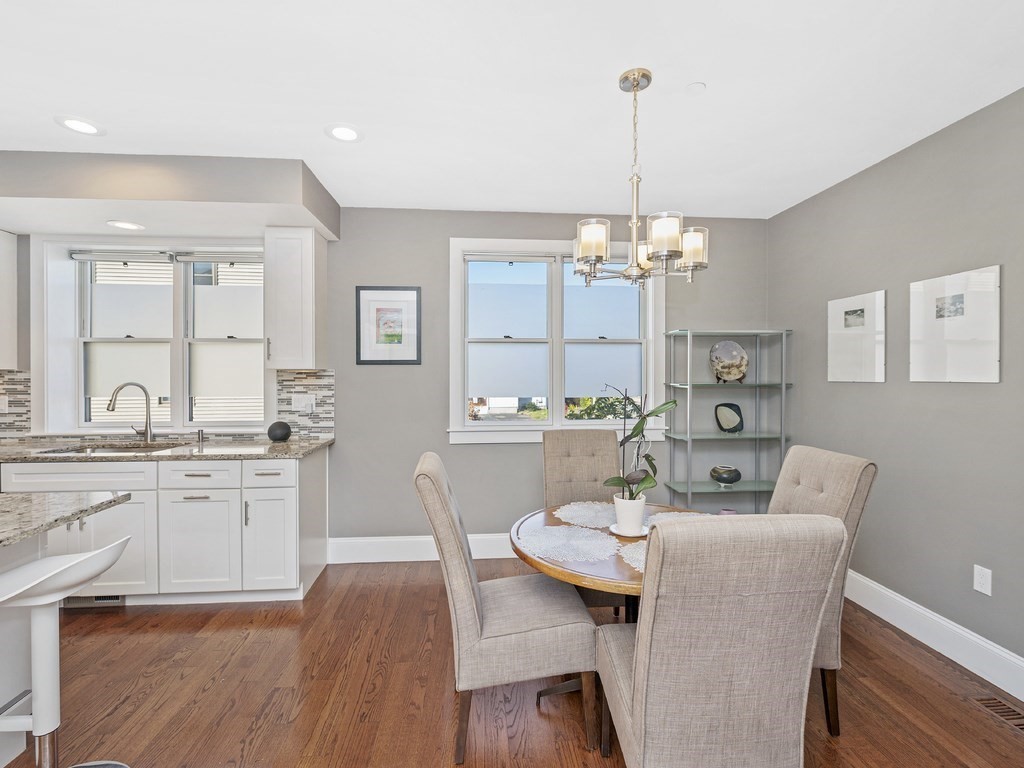 198 California Street, Unit 3 Newton, MA 02458 - Photo 16 of 34 a view of a dining room with furniture window and wooden floor