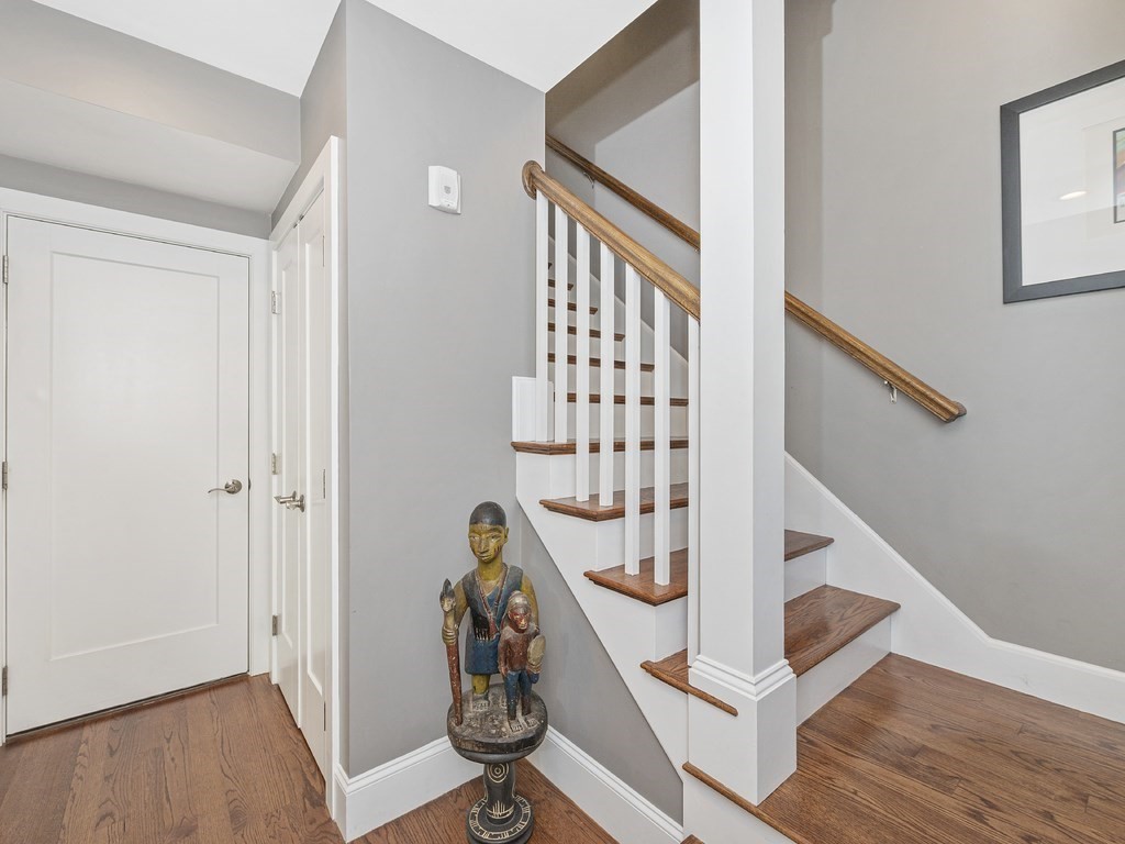 198 California Street, Unit 3 Newton, MA 02458 - Photo 17 of 34 a view of entryway with wooden floor and stairs