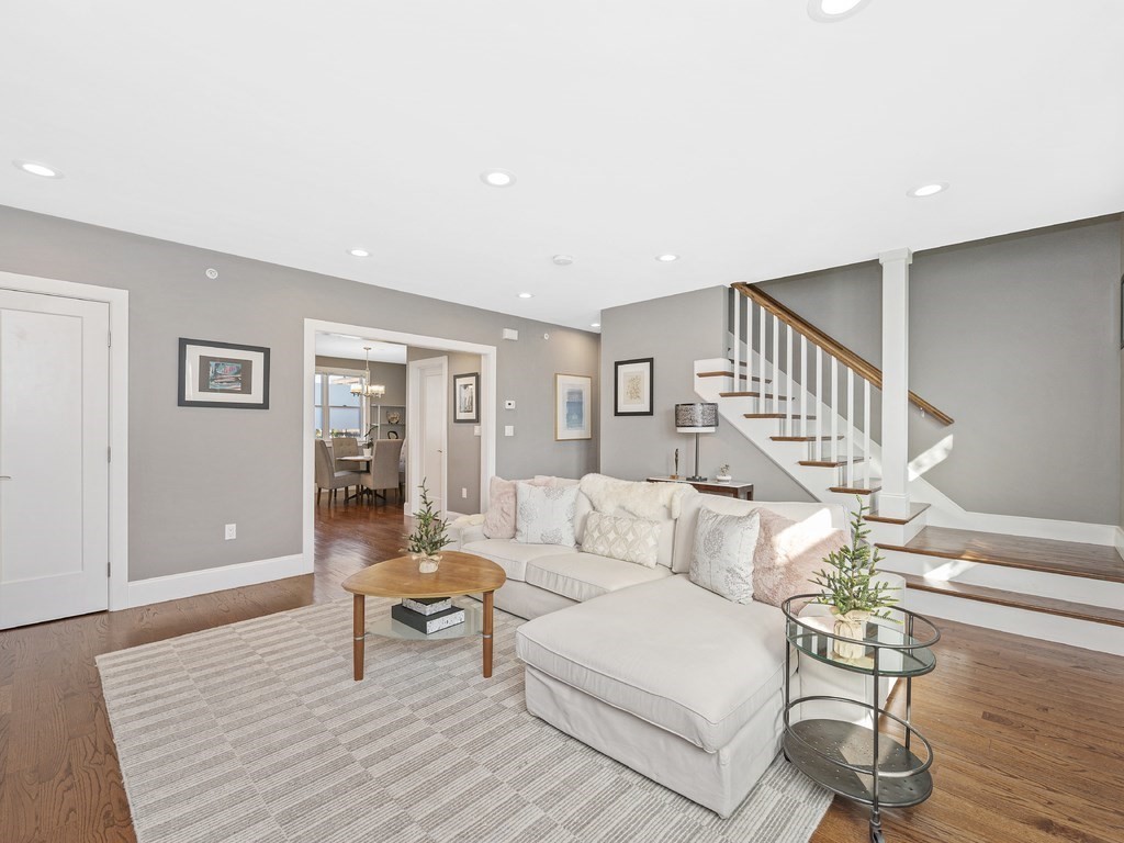 198 California Street, Unit 3 Newton, MA 02458 - Photo 10 of 34 a living room with furniture and a wooden floor