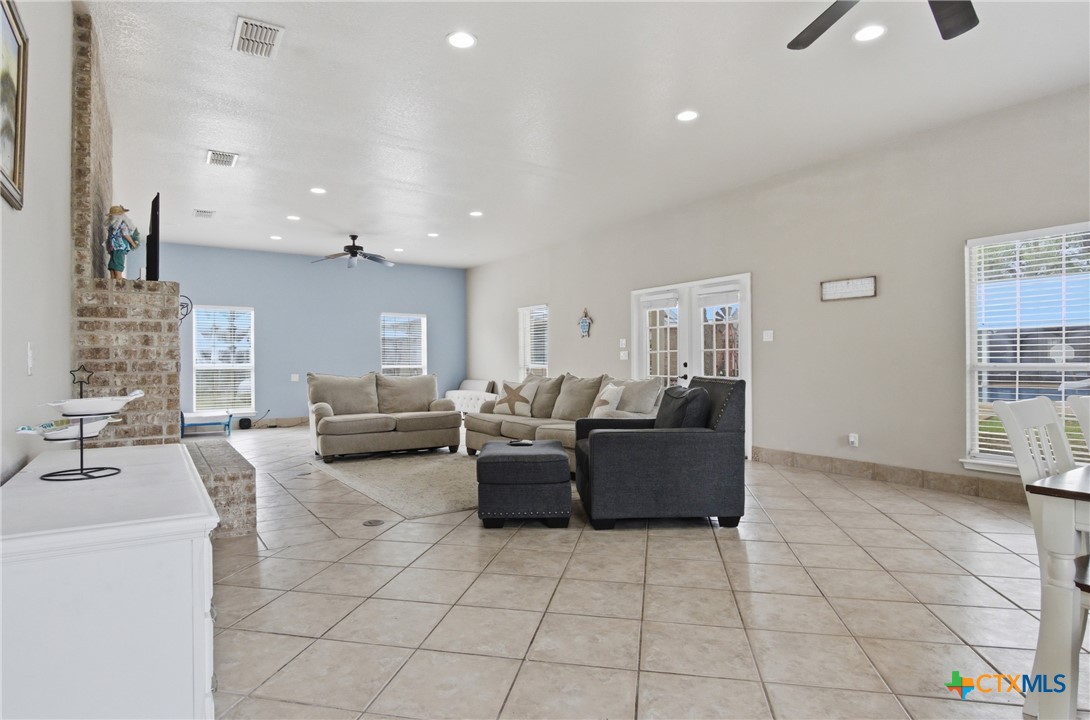 642 Phantom Rider Trail Spring Branch, TX 78070 - Photo 30 of 41 a living room with furniture and a chandelier