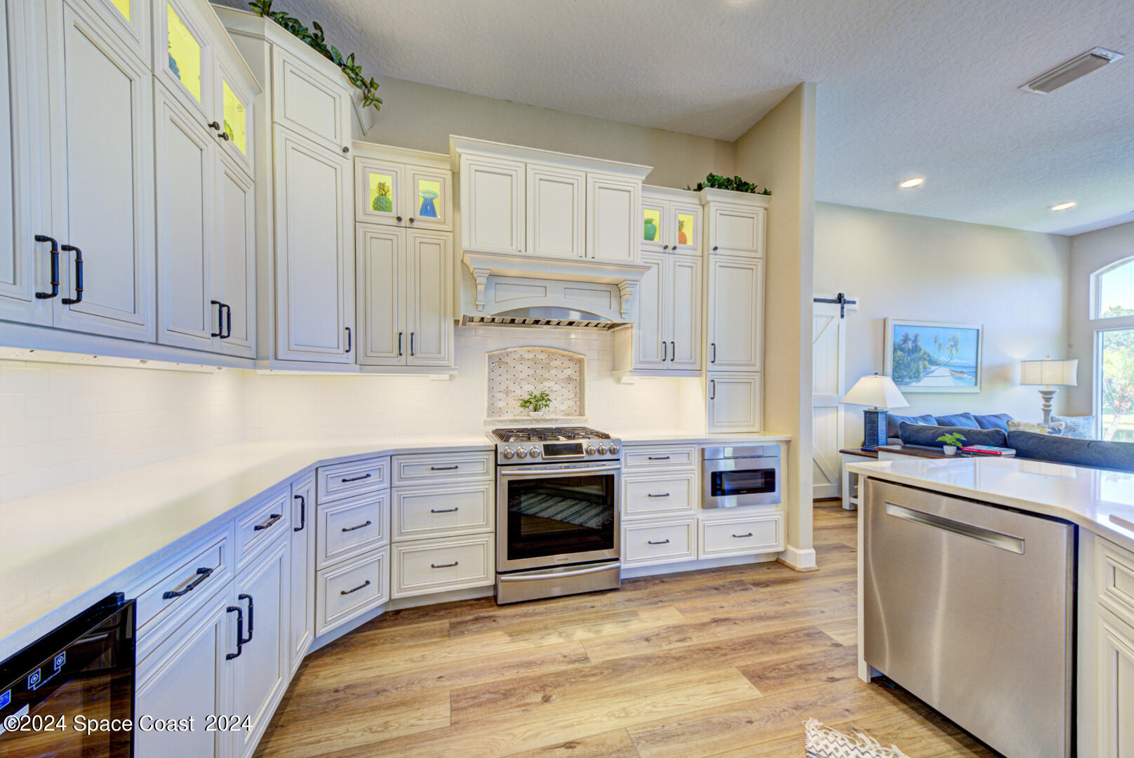 4070 Stoney Point Road Melbourne, FL 32940 - Photo 15 of 75 a kitchen with stainless steel appliances granite countertop a stove and a refrigerator