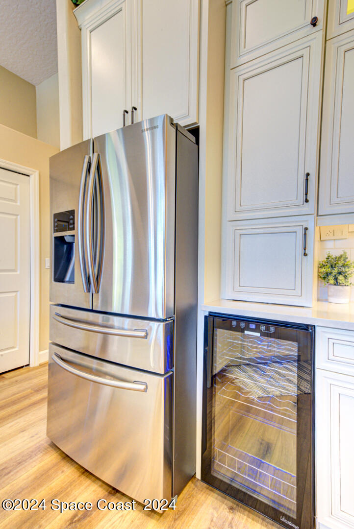 4070 Stoney Point Road Melbourne, FL 32940 - Photo 17 of 75 kitchen with chiller fridge