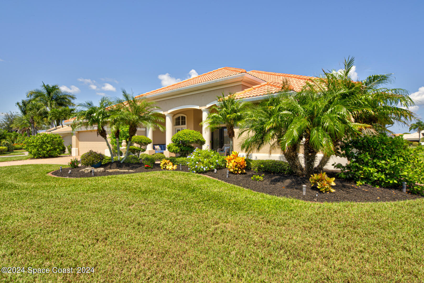 4070 Stoney Point Road Melbourne, FL 32940 - Photo 2 of 75 a view of a house with backyard sitting area and garden