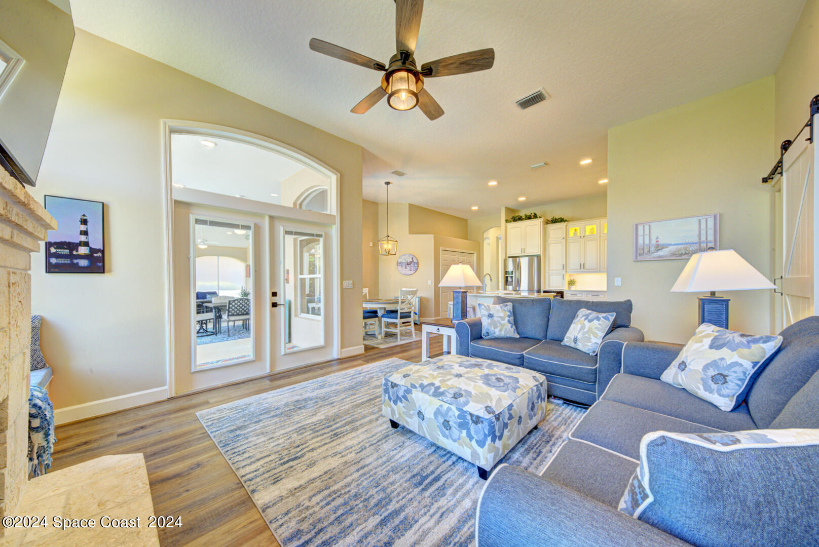 4070 Stoney Point Road Melbourne, FL 32940 - Photo 21 of 75 a living room with furniture and a chandelier