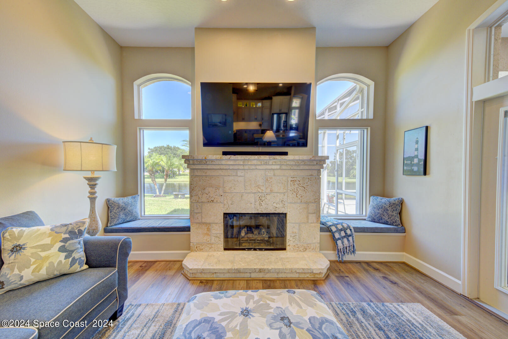 4070 Stoney Point Road Melbourne, FL 32940 - Photo 22 of 75 a living room with furniture and a fireplace