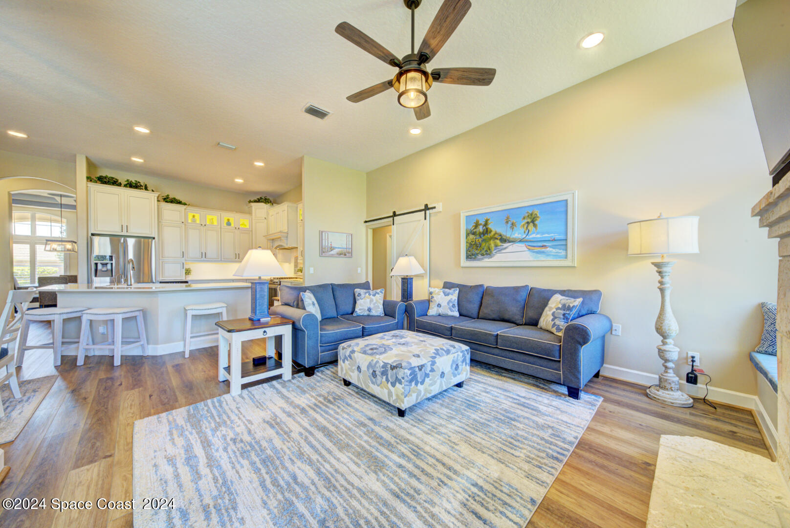 4070 Stoney Point Road Melbourne, FL 32940 - Photo 26 of 75 a living room with furniture and a wooden floor