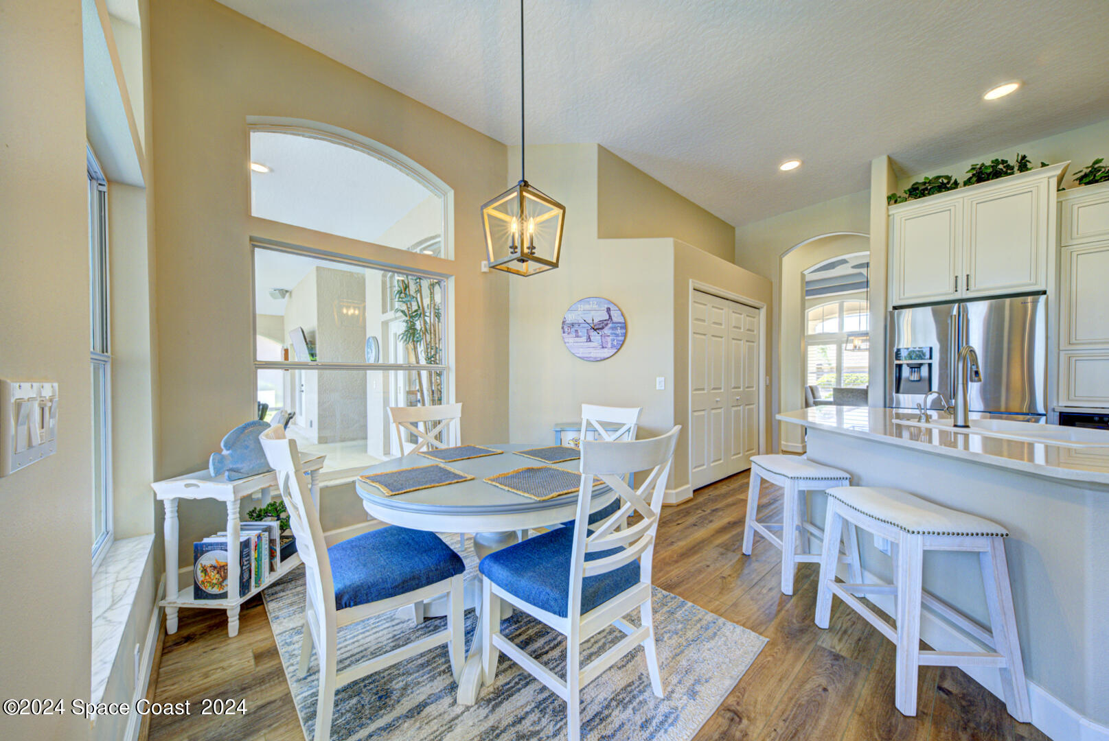 4070 Stoney Point Road Melbourne, FL 32940 - Photo 29 of 75 a dining room with furniture a chandelier and window