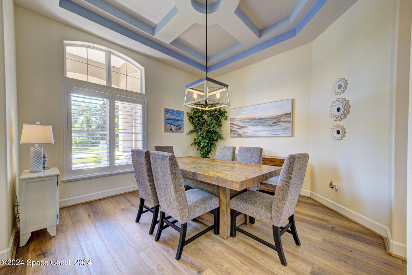 4070 Stoney Point Road Melbourne, FL 32940 - Photo 32 of 75 a dining room with furniture window and wooden floor