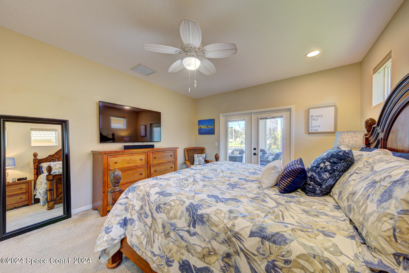 4070 Stoney Point Road Melbourne, FL 32940 - Photo 36 of 75 a bedroom with a bed and a flat screen tv
