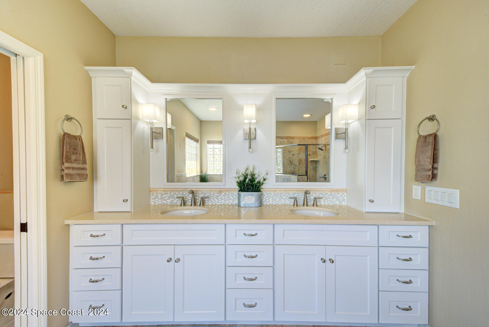 4070 Stoney Point Road Melbourne, FL 32940 - Photo 38 of 75 a bathroom with a double vanity sink mirror and double