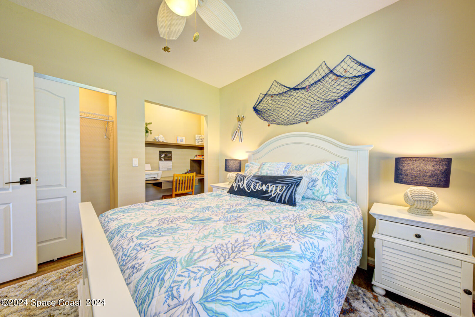 4070 Stoney Point Road Melbourne, FL 32940 - Photo 46 of 75 a bedroom with a bed and wooden floor