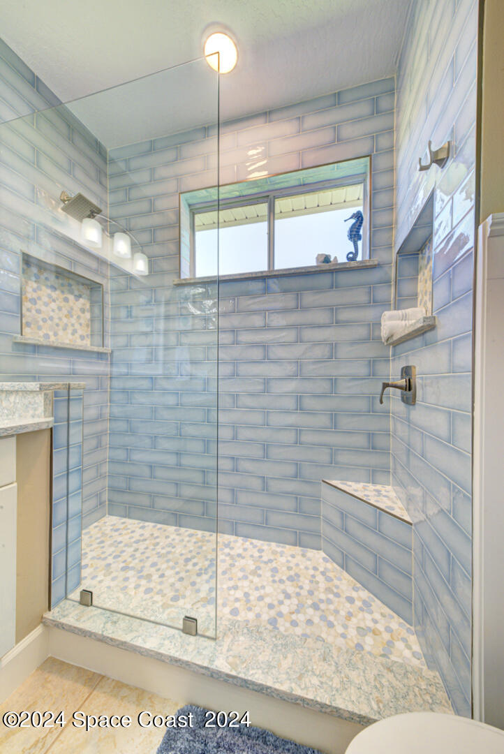 4070 Stoney Point Road Melbourne, FL 32940 - Photo 48 of 75 a bathroom with a shower