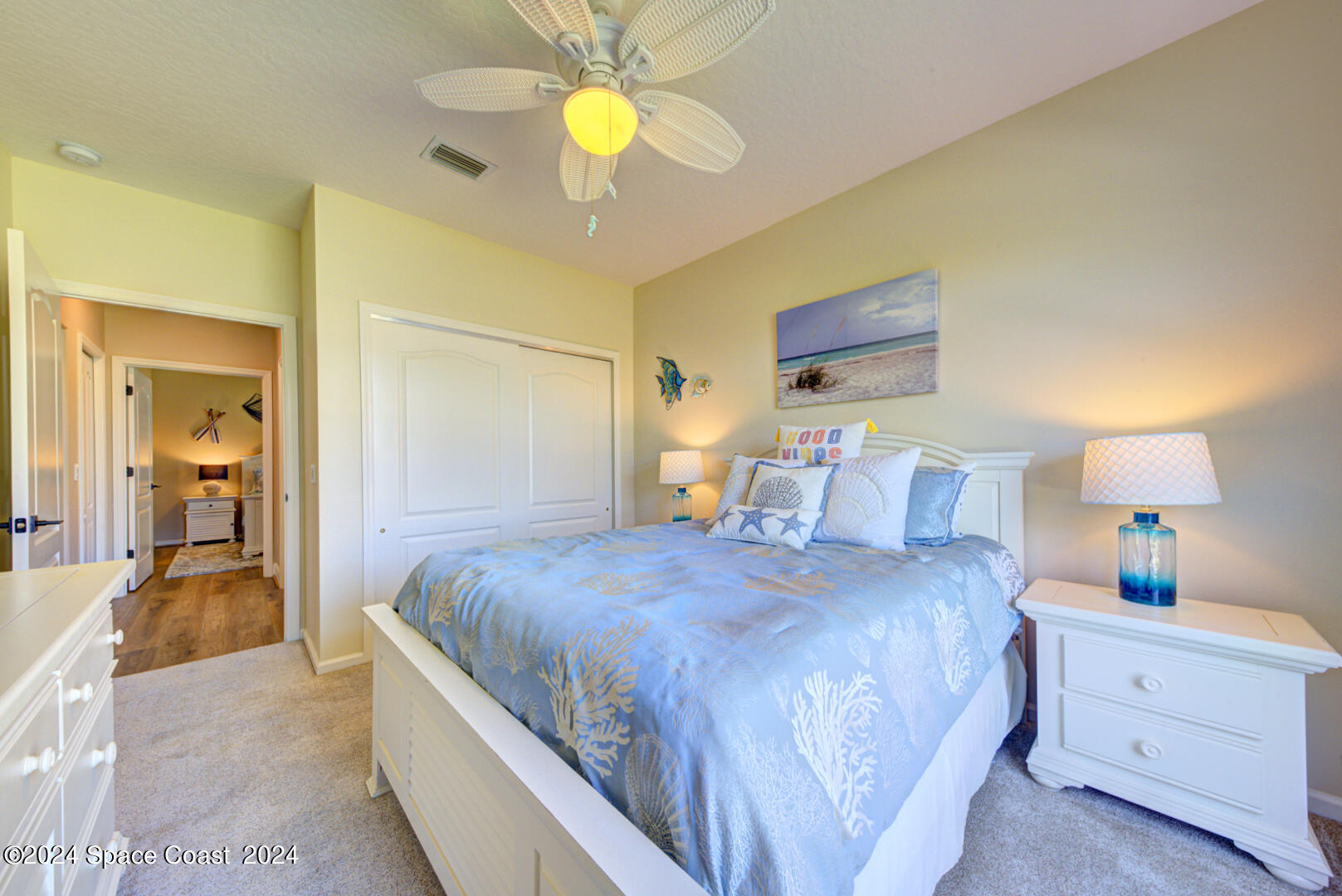 4070 Stoney Point Road Melbourne, FL 32940 - Photo 54 of 75 a bedroom with bed and a chandelier