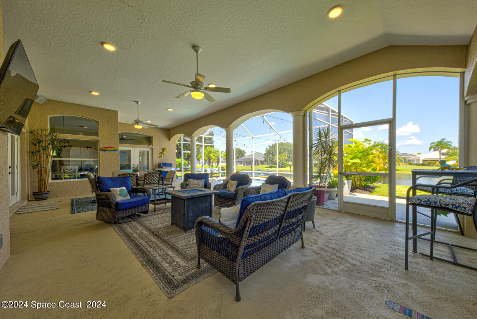 4070 Stoney Point Road Melbourne, FL 32940 - Photo 61 of 75 a living room with furniture and a large window