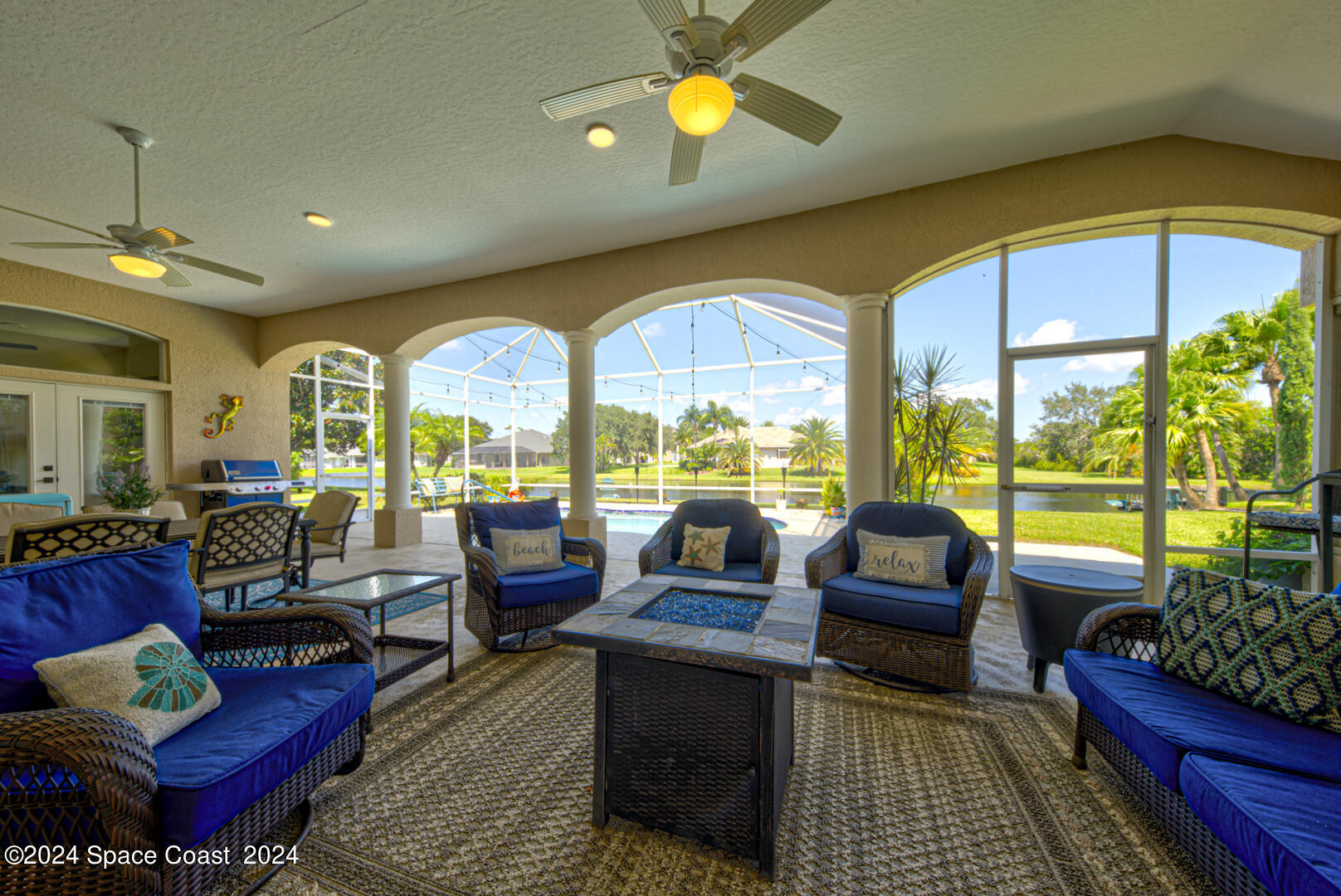 4070 Stoney Point Road Melbourne, FL 32940 - Photo 62 of 75 a living room with furniture and a large window